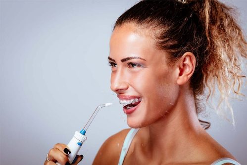 young-girl-washing-teeth-1024x683-1024x683 Новинка Revyline RL 800 - самый необычный портативный ирригатор